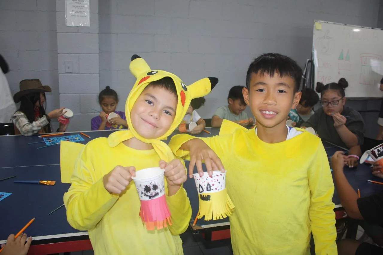 Saint Paul students smiling together during a classroom activity